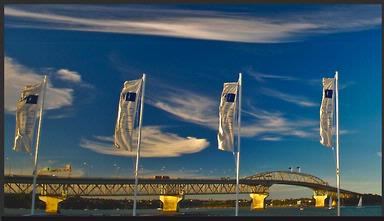  Flags at Westhaven Yacht Basin snap in the breeze as the harbour bridge catches the last of the evening light.